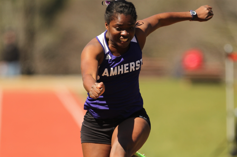 College female competes in outdoor track meet