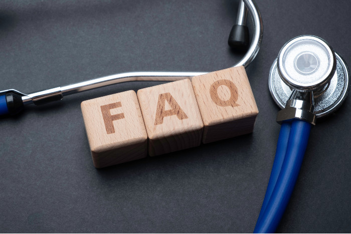 blocks with the letters FAQ with a stethoscope around it
