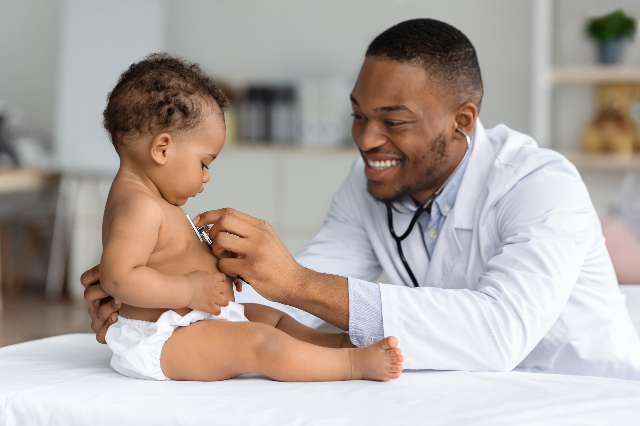 a pediatrician with a baby