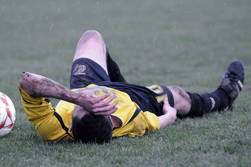 Soccer player lay on field after injury