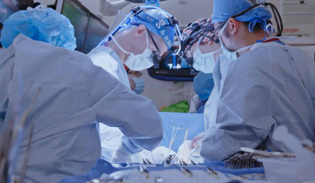 Doctors conduct heart surgery