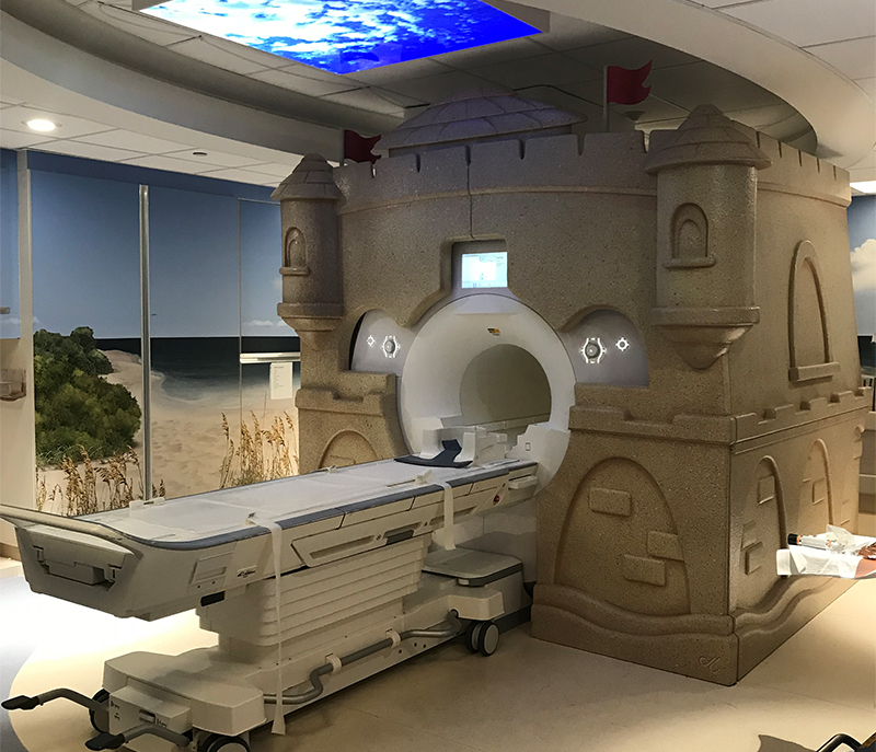 MRI machine decorated with a sandcastle