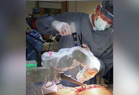 Dr. Daniel Hedequist performs spinal surgery.